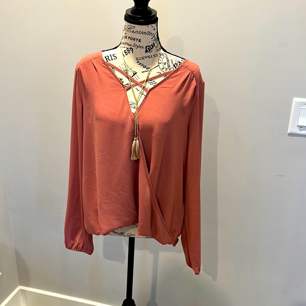 Stylish long sleeve cross front blouse by Guess. Size L. Excellent condition.